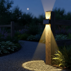 Halo solar wall light on garden fence post lighting gravel path at night