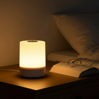 Dusk touch bedside lamp on nightstand beside an open book