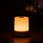 Aurevia Dusk touch bedside lamp glowing warm at night