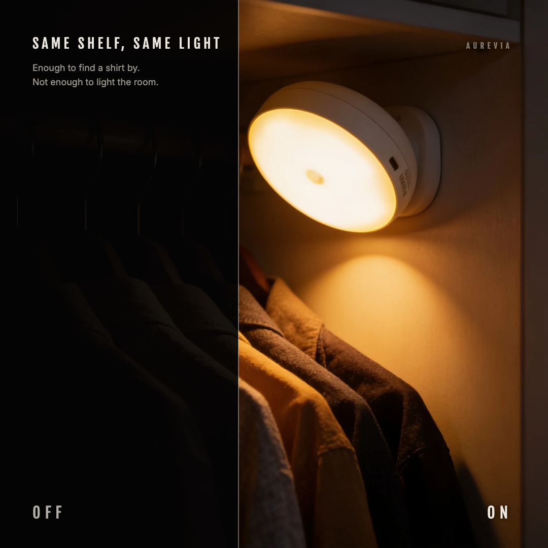 A wardrobe rail split down the middle, dark on the left and lit by the Pebble night light on the right